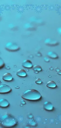 This phone live wallpaper features a close-up of water droplets photographed in macro detail