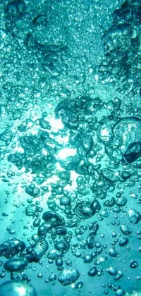 Introduce your phone to the captivating underwater wonder of bubbles with this stunning live wallpaper