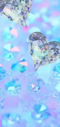 This live phone wallpaper showcases two heart-shaped diamonds fluttering in the air, creating a visually stunning macro effect