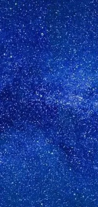 This phone live wallpaper features a beautiful blue sky filled with sparkling stars set against a metallic nebula and stunning blue sand
