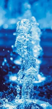 This is a stunning phone live wallpaper showcasing a digital rendering of a beautiful blue fountain