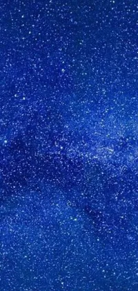 This live wallpaper features a stunning blue sky chock full of brilliant stars and the Milky Way, all within a pointillism painting style