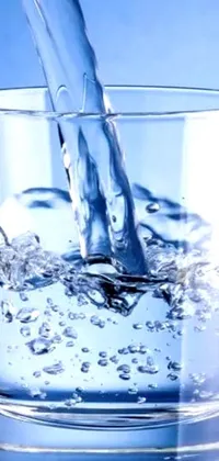 This phone live wallpaper depicts a glass being filled with water in a stunning 8k highly-detailed gif or video