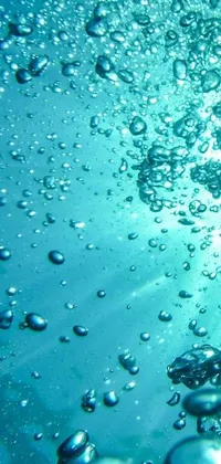 This phone live wallpaper features a stunning digital art display of bubbles floating in water