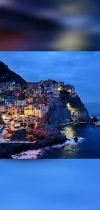 Looking for a breathtaking phone live wallpaper that'll take your breath away? Check out this stunning image of an idyllic Italian town situated on a cliff overlooking the ocean