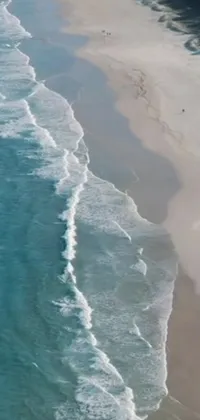 Get lost in the serene beauty of a beach and the sea with this phone live wallpaper