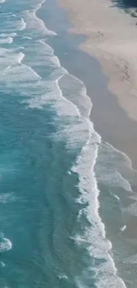 This incredible live wallpaper features an emerald coast along the South African coastline