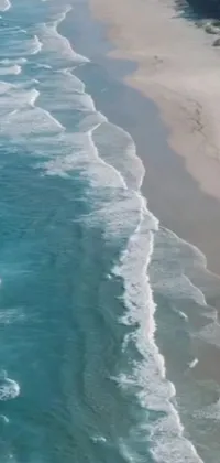 This phone live wallpaper captures the natural beauty of the South African coast with a stunning view of the emerald coast