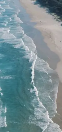 This phone live wallpaper showcases the serene South African coast with soaring waves and sparkling blue waters