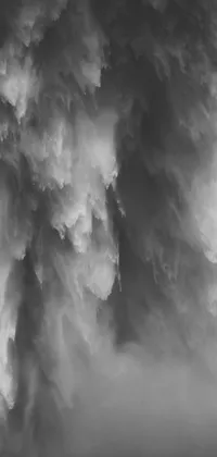 This phone live wallpaper boasts a stunning monochrome photo of a cloudy sky, paired with a waterfall fluid simulation created in Houdini