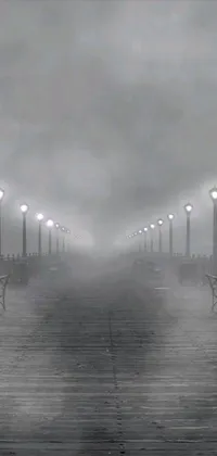 This live wallpaper features a captivating black and white image of a foggy pier with a romantic, haunting feel
