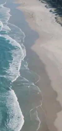 This phone live wallpaper showcases a magnificent aerial view of a serene beach along the Gold Coast of Australia