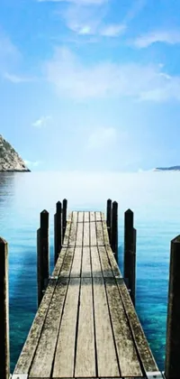 This mobile phone live wallpaper presents a soothing scene of a dock positioned amidst an expansive, serene body of light blue water