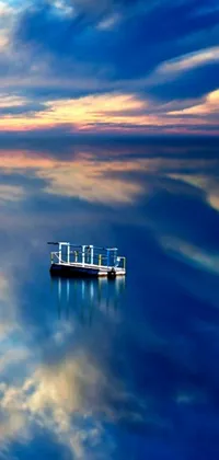 This beautiful live wallpaper features a realistic photo of a boat floating on tranquil waters