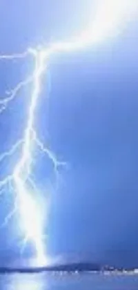 Looking for a stunning live wallpaper to spruce up your phone screen? Look no further than this captivating design featuring an imposing lightning bolt against a serene body of water - ideal for a profile picture or exploitable image
