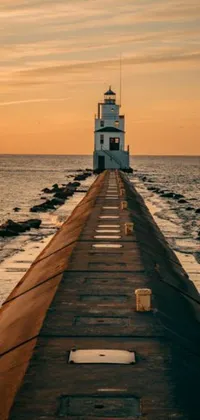 This phone live wallpaper depicts a stunningly realistic image of a light house on a pier, standing tall amidst the vast ocean