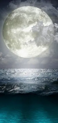 This stunning live wallpaper features a surrealistic full moon rising over a cloudy ocean