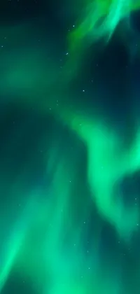 Get mesmerized by the serene beauty of the aurora borealis with this stunning phone live wallpaper! Against the backdrop of a dark, starry night sky, you can witness the dazzling display of colorful lights that dance and shimmer in intricate patterns