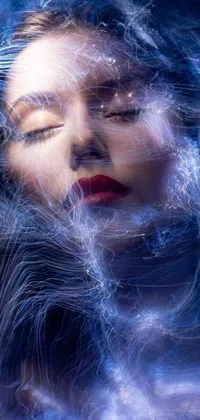 This phone live wallpaper features a captivating digital art piece, depicting a serene woman with eyes closed and hair blowing in the wind