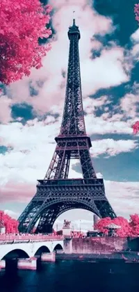 This live wallpaper showcases the Eiffel Tower in infrared hues of pink and teal