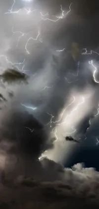 This phone live wallpaper presents a striking image of a thundercloud with vivid lightning strikes bursting through it
