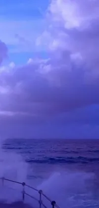 This live wallpaper features a group of people standing on a boat in the ocean