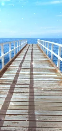 This phone live wallpaper features a stunning wooden pier extending into the crystal-clear ocean, presenting users with a serene and tranquil scene