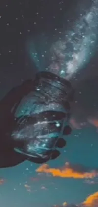 Get lost in the magic of this enchanting live wallpaper featuring a galaxy in a bottle