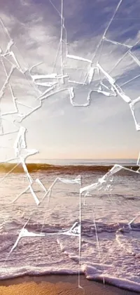 This phone live wallpaper features a close-up shot of a broken beach window in digital art style from Pexels