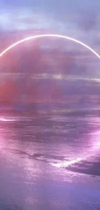 This live phone wallpaper showcases a dynamic scene of a surfer riding the waves on a beach set against a vibrant pink and purple backdrop