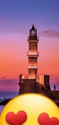 This phone live wallpaper showcases a picturesque lighthouse in front of a stunning sunset panorama