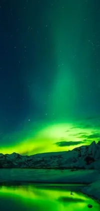 Enjoy the incredible beauty of the aurora borealis on your phone's live wallpaper! This stunning image, provided by Pexels, depicts the colorful natural phenomenon against the backdrop of a frozen lake