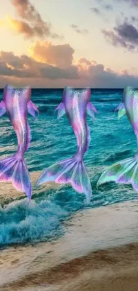 Looking for a breathtaking live wallpaper for your phone? Look no further than this stunning underwater scene featuring a group of vibrant fish resting on a sandy beach