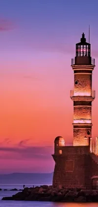 This mobile live wallpaper showcases a vibrant and scenic lighthouse amidst tranquil blue water and Mardin's old town
