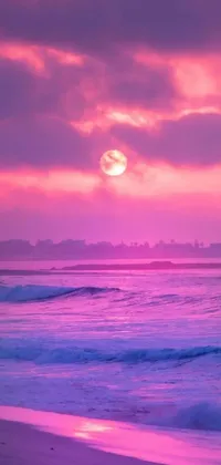 This live wallpaper depicts a stunning sunset beach scene