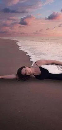 This phone live wallpaper showcases a surreal viral photo of a woman enjoying a peaceful day at the beach