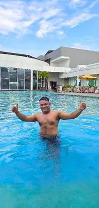 This energetic live wallpaper features a man standing confidently in a swimming pool, with a serene expression on his face