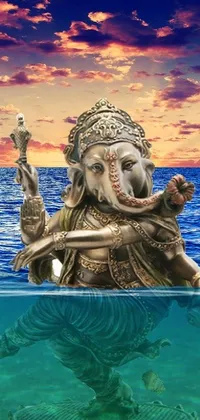 This phone live wallpaper showcases an exquisite digital rendering of an elephant statue positioned in a serene waterbody
