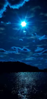 This phone live wallpaper depicts a breathtaking scene of a full moon shining over a serene body of water