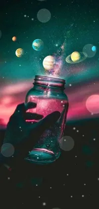 This mesmerizing live phone wallpaper depicts a jar filled with planets, suspended in magical colors and atmosphere