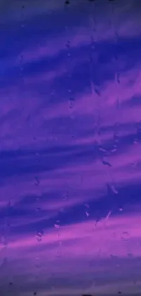 Get mesmerized by the purple and blue hues of this rain-inspired live phone wallpaper