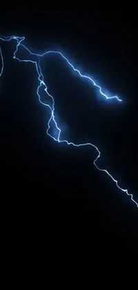 This phone wallpaper shows a close-up of a lightning bolt in bright blue indigo set against a black backdrop