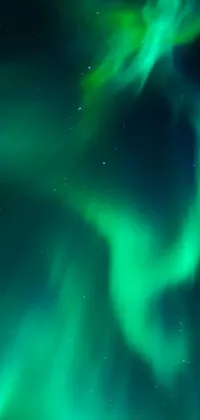 Bring the magic of the Northern Lights to your phone's screen with this live wallpaper! Featuring a stunning display of vibrant green and blue hues, it perfectly captures the breathtaking beauty of the Aurora Borealis
