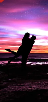 This stunning live wallpaper features an idyllic beach scene at sunset, with a couple sharing a passionate kiss