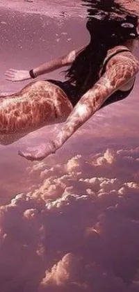 This phone wallpaper showcases a hyperrealistic painting featuring a surreal scene of a woman floating with a giraffe in the water