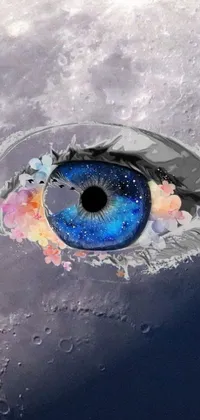 This mobile wallpaper depicts a close-up of an eye with the moon in the background