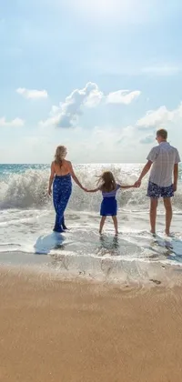 This lively phone live wallpaper features a delightful portrait of a family of three enjoying the sun and sand at a beautiful beach