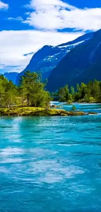 This live phone wallpaper is a scenic masterpiece showcasing a river flowing calmly in front of a magnificent mountain range