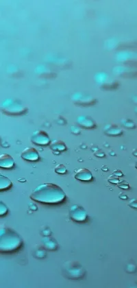 This mobile live wallpaper showcases a stunning close-up of water droplets on a surface
