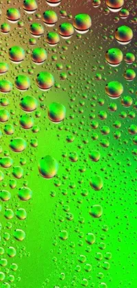 This phone live wallpaper features a set of vibrant and dynamic bubbles displayed on top of a green surface, in 1024x1024 format